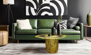 Round coffee table near green leather sofa against black wall with pattern art poster. Art deco style home interior design of modern living room.